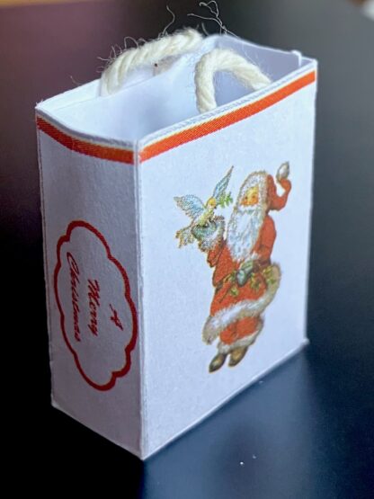 Geschenktasche (Nikolaus mit Taube). Papier.