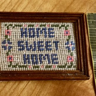 Bild (Home Sweet Home, gestickt, d'blau). Rahmen d'kl. Reduz.