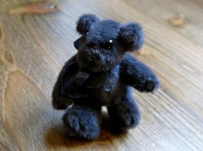 Miniaturteddy (Plüsch, nachtblau). Handarbeit.